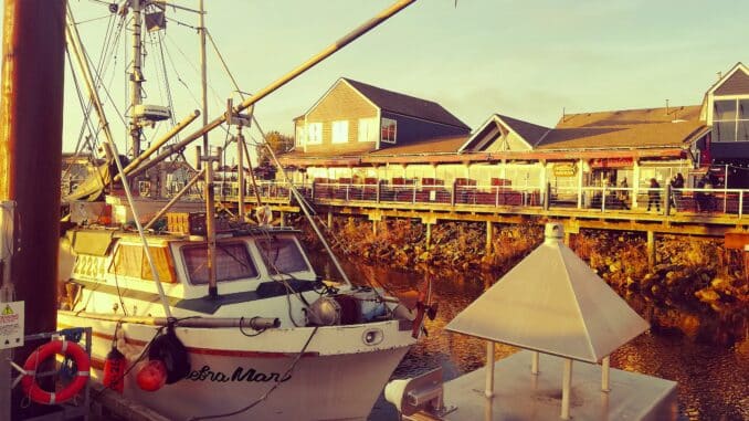 Sunset Reflections Walking the Boardwalk at Fisherman's Wharf - Photo By Thanasis Bounas